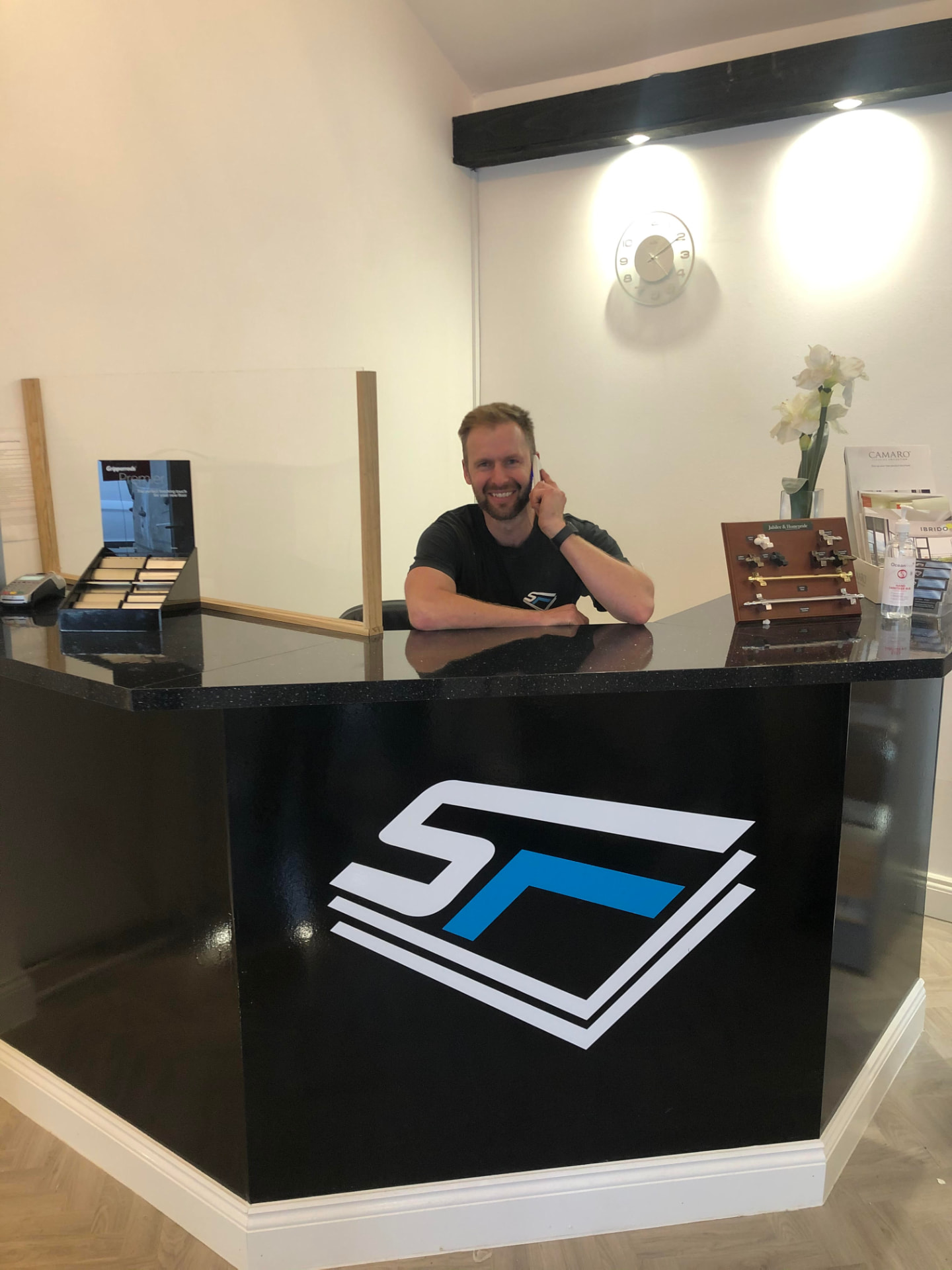 Jack, owner of Simply Flooring Experts, at the showroom reception